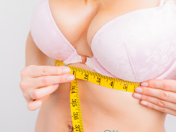 Woman measuring her bra size