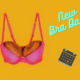 A fuchsia pink bra with coconuts in the cups is on a deep orange background. There is a graphic of a calendar with a date marked. Text reads 'new bra day!'