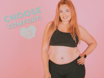 a woman faces the camera wearing a black sports bra and black leggings. She has her hand on her hip and wears a sports watch. Text reads 'choose comfort' with a hug emoji.