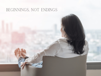 view of the back of a woman sitting on a chair looking out of a window on a city landscape. Her bare feet are up on the windowsill. Text reads 'beginnings, not endings'.