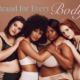 four women of different races and sizes stand close together with their arms on each other's shoulders. They wear different varieties of underwear. Text reads 'a brand for every body'
